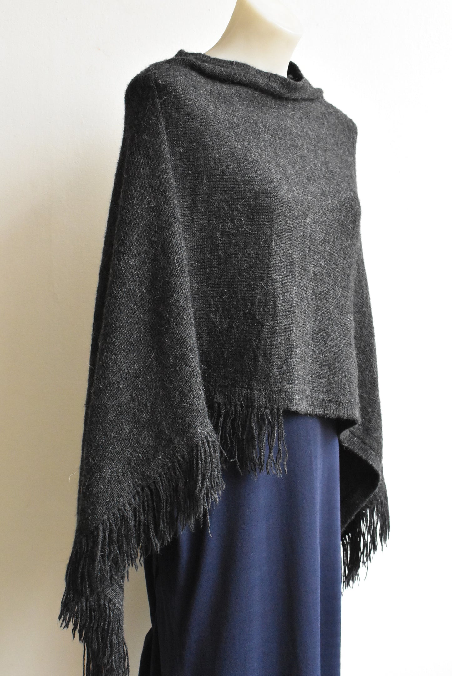 Grey fringed poncho