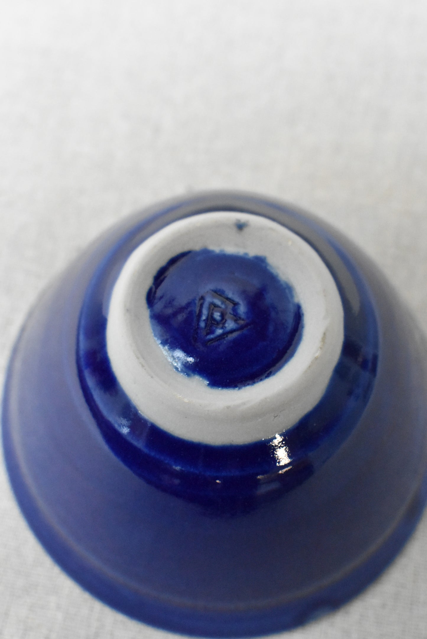 Small deep blue glazed ceramic bowl