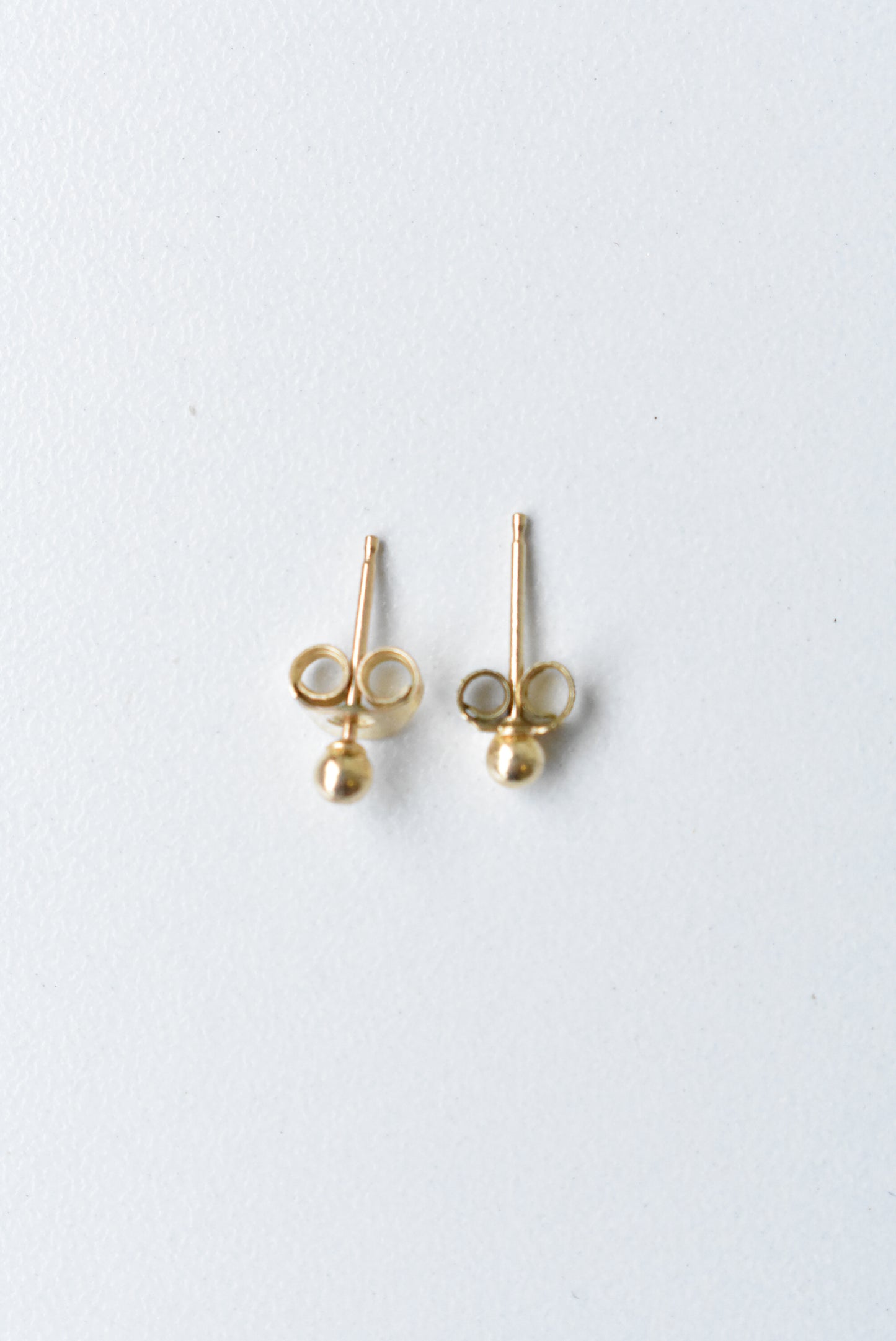 Tiny 14ct gold stud earrings