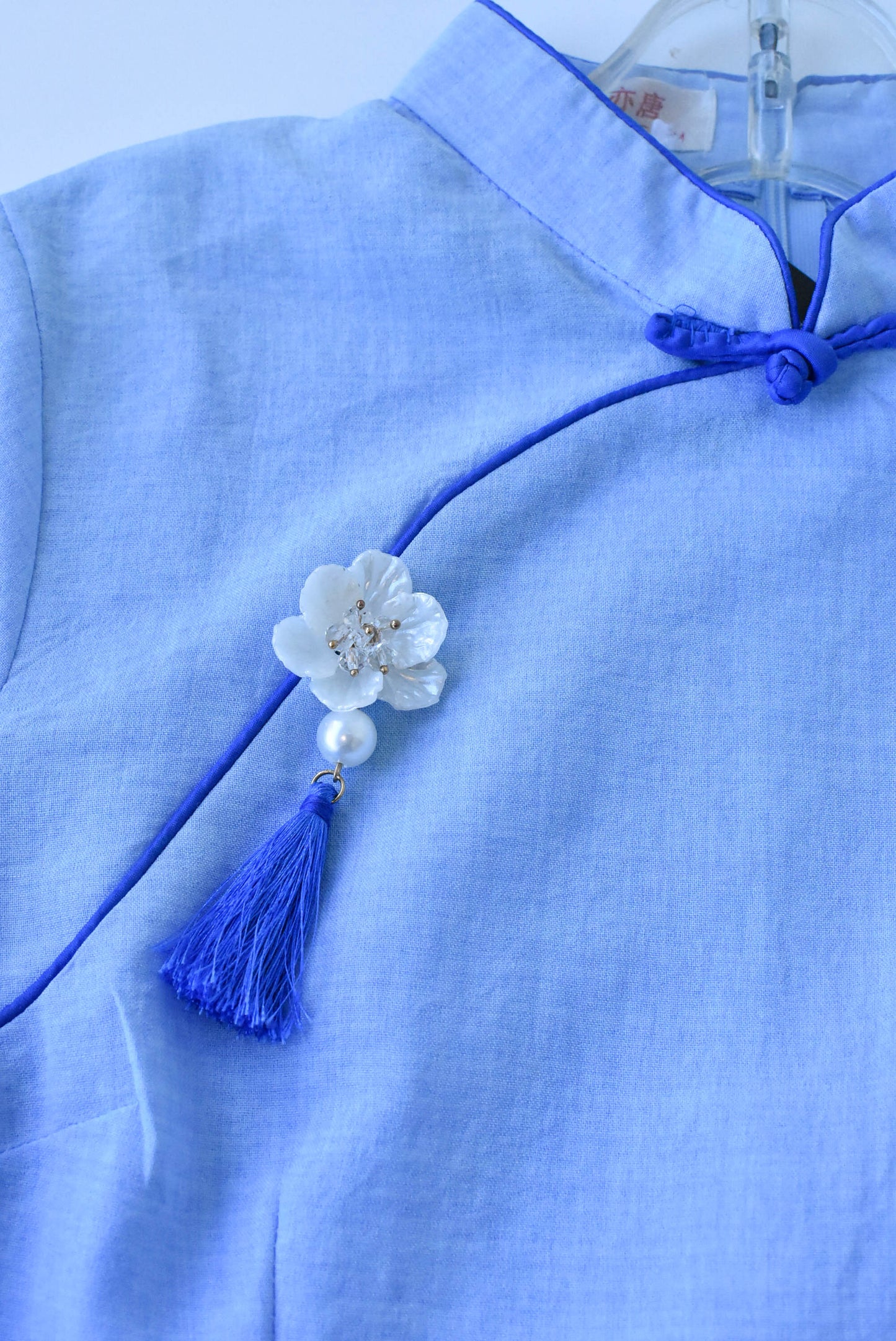 Gu Yitang light blue top with flower, size XS