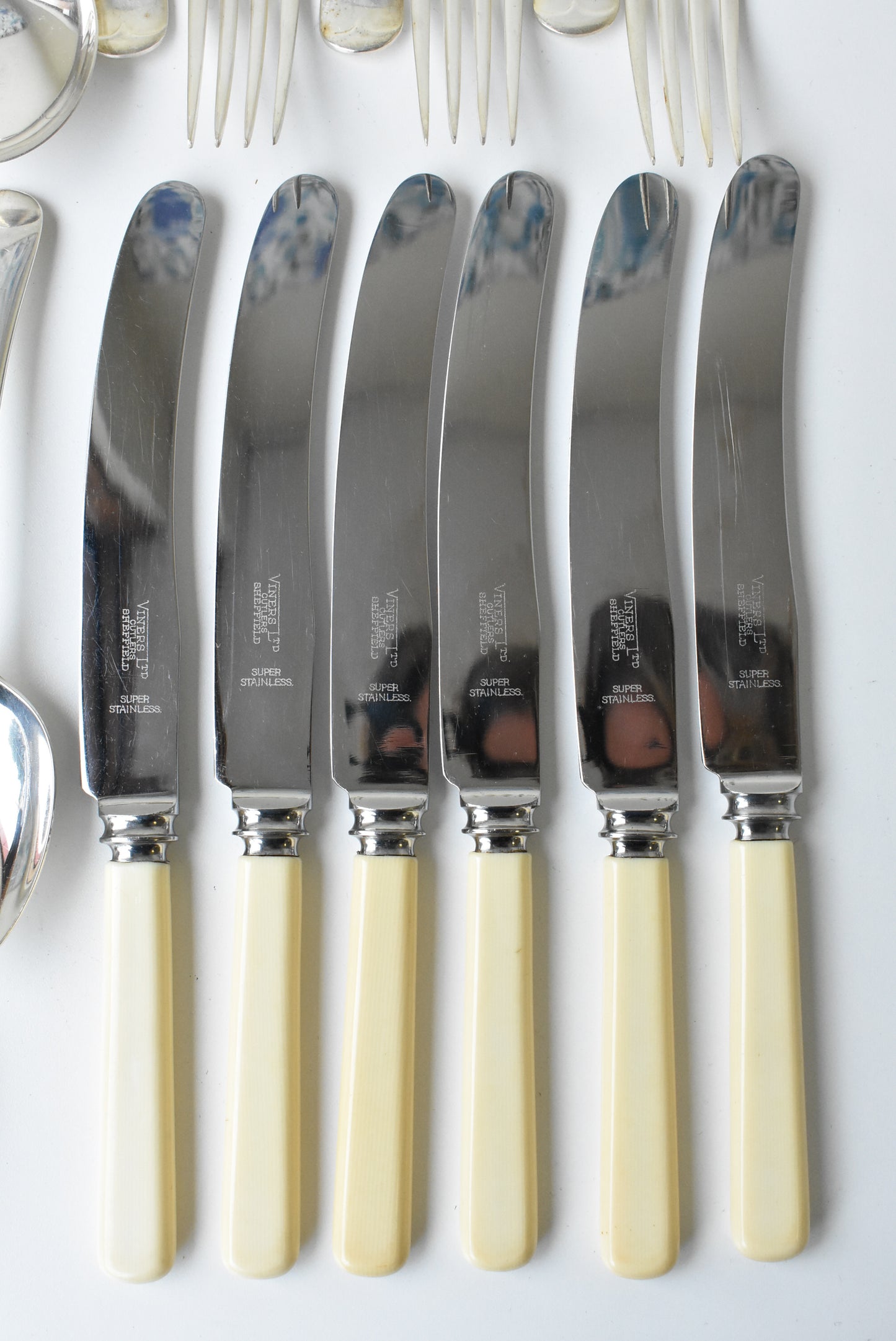 24 piece assorted set of forks, knives, dessert spoons, soup spoons
