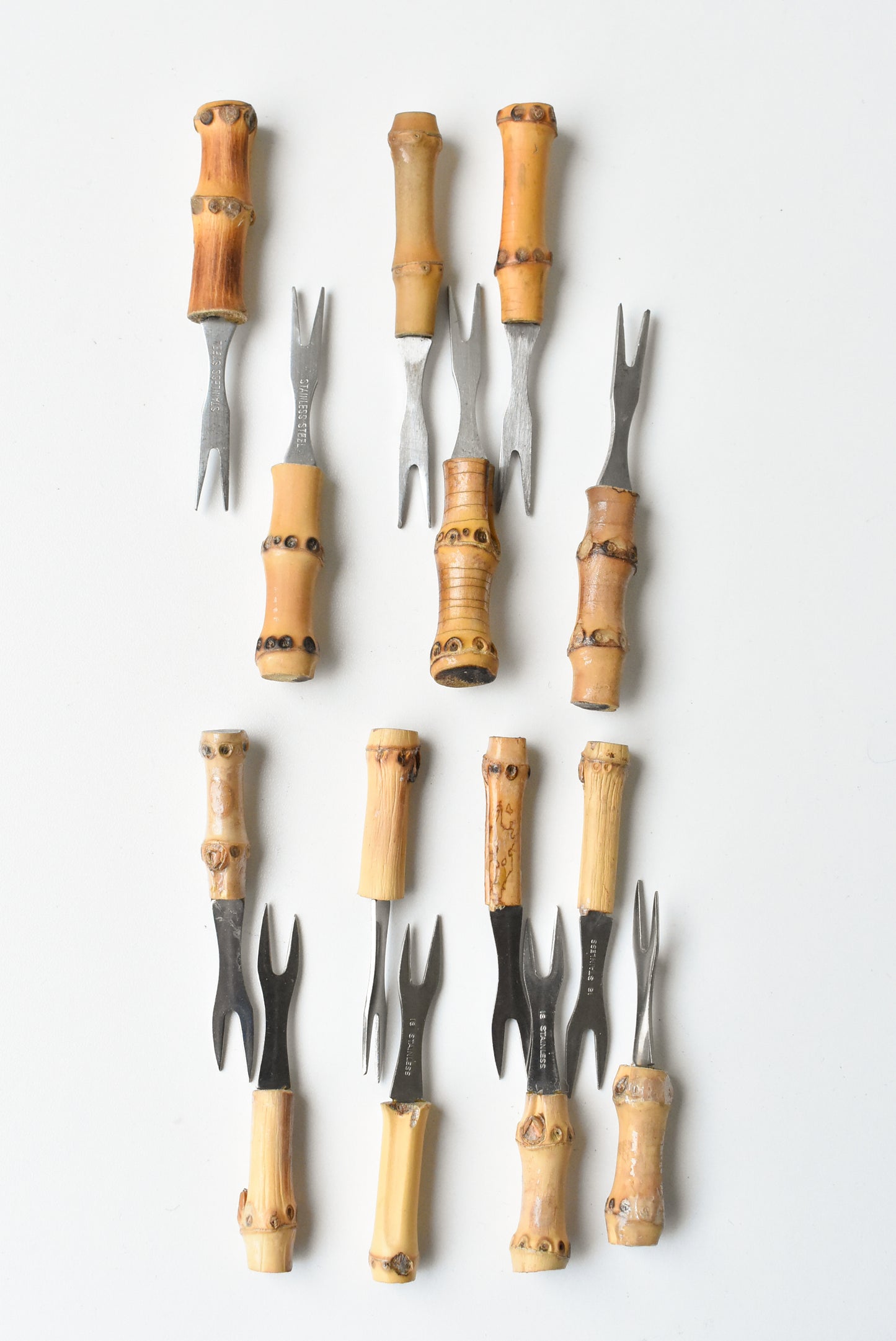 Set of stainless steel bamboo handled 1960s cocktail forks