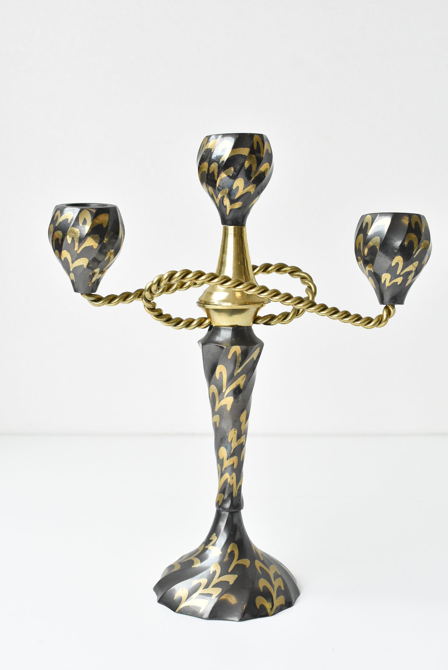 Three flame metal candelabra