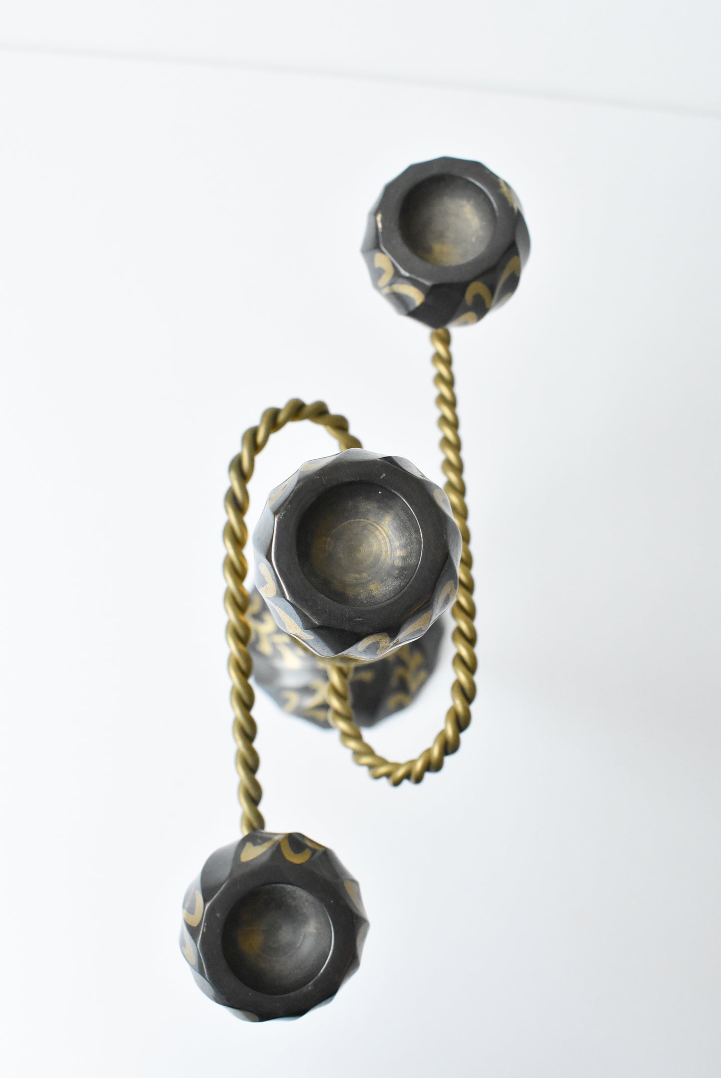 Three flame metal candelabra