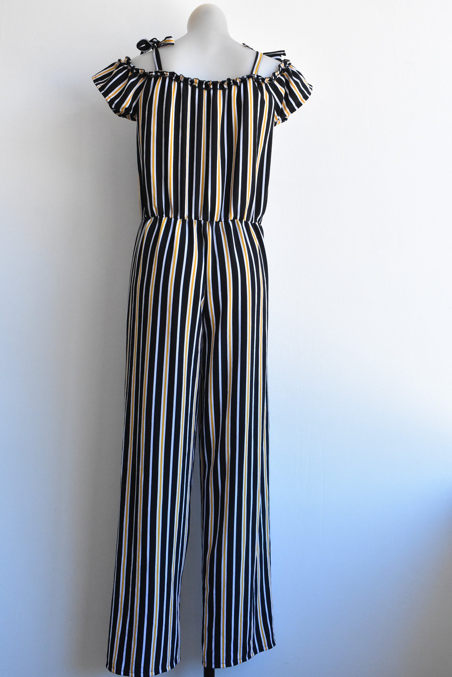Switch Girls off-the-shoulder black/orange striped jumpsuit, size 16yrs (likely fit size 6/8 adult)