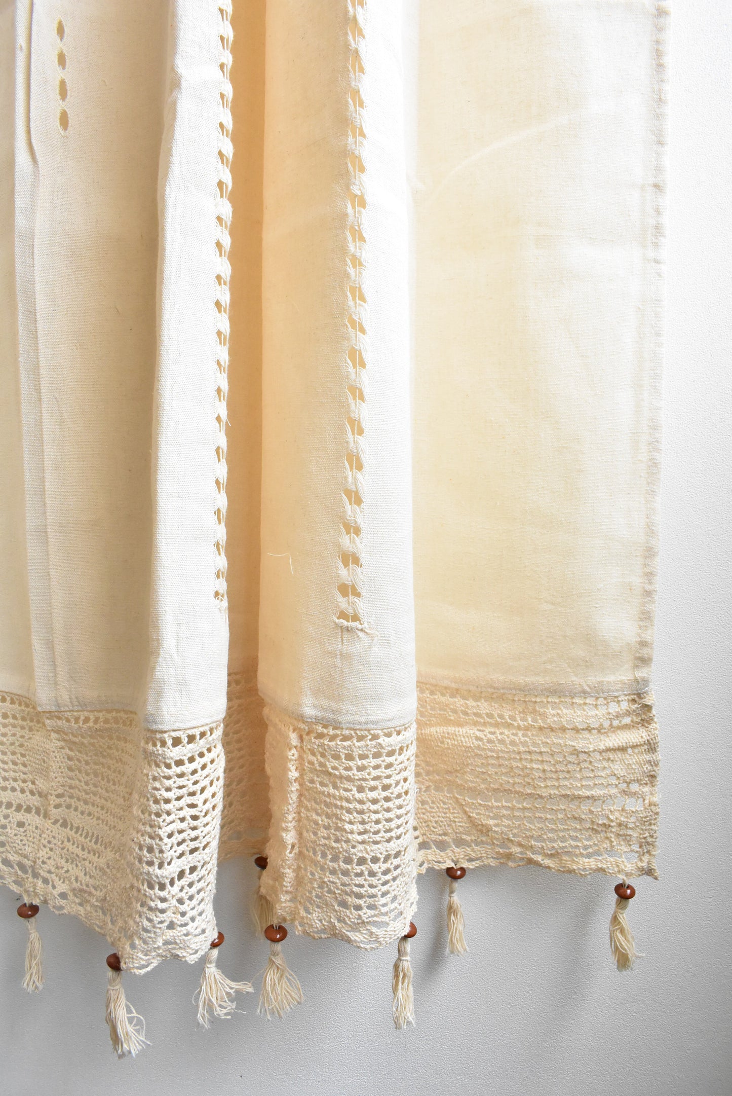 Pair of cotton tab curtains with macramé and beaded fringe