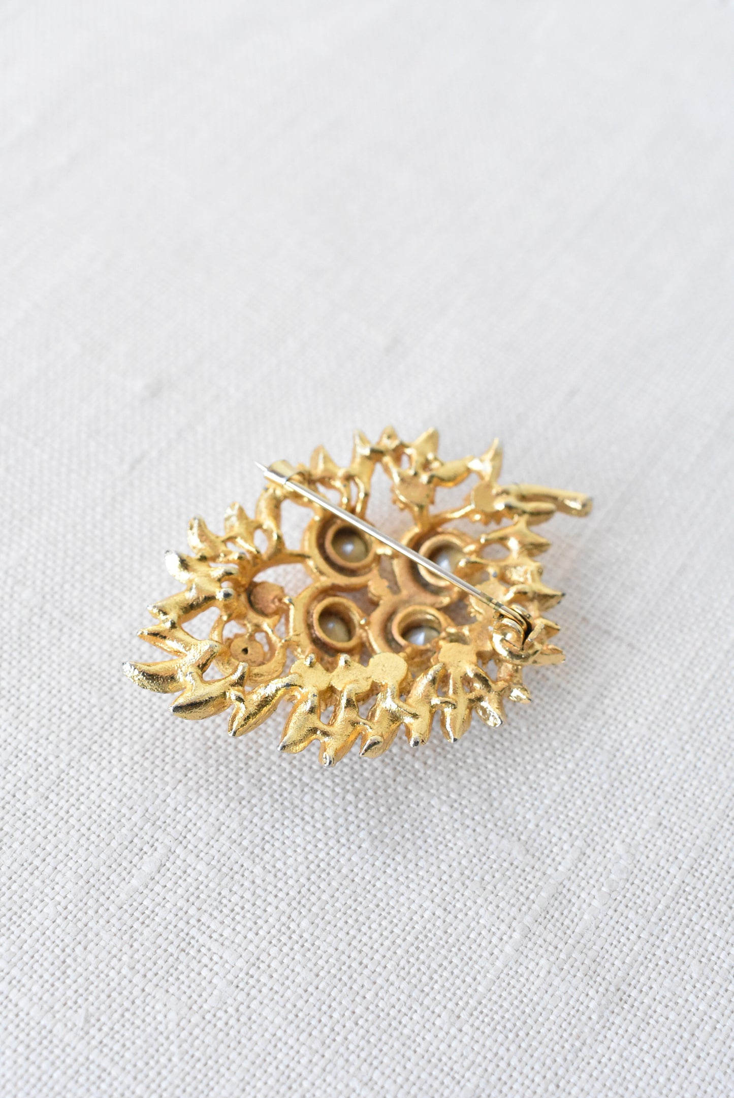 Vintage golden + blue gems brooch