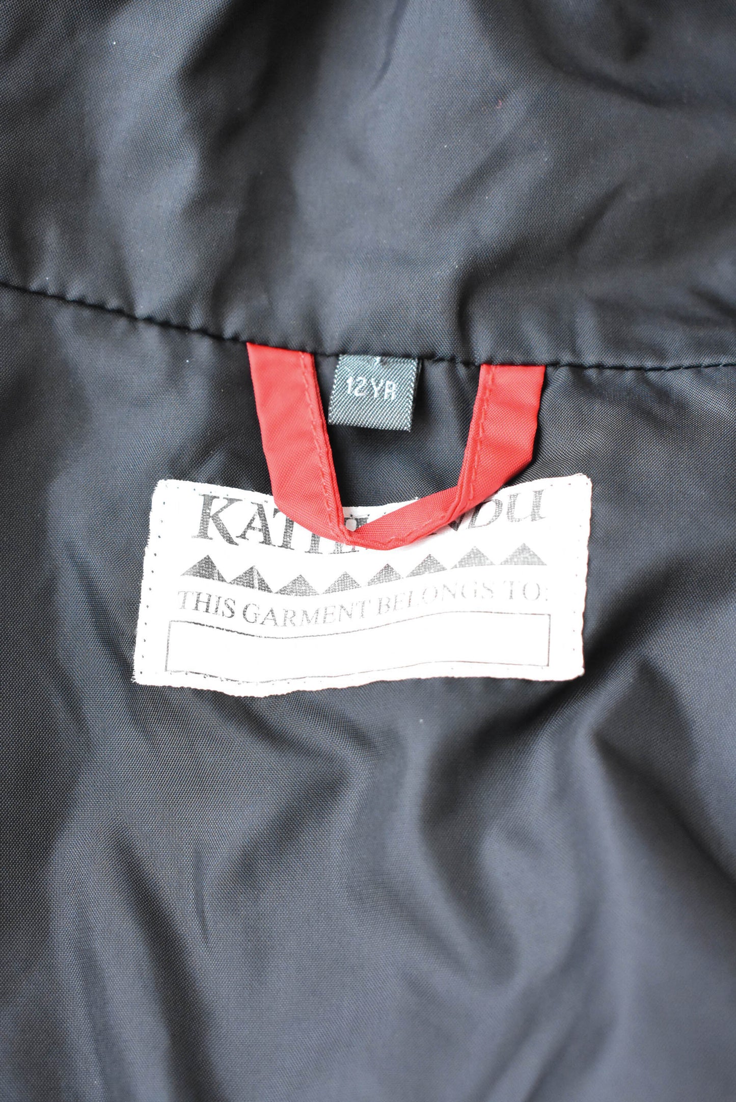 Kathmandu red kids rain jacket (12 yr)