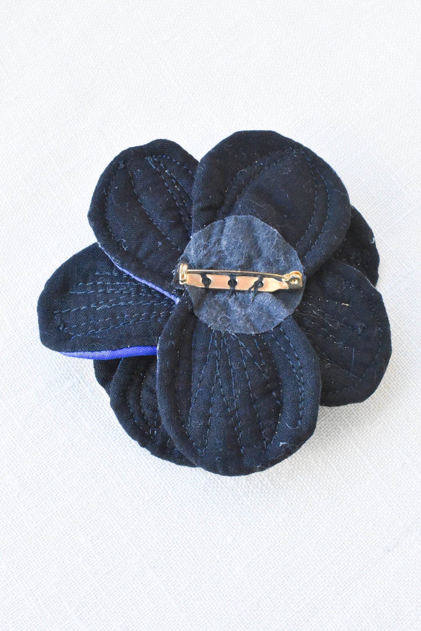 Large blue/gold fabric flower brooch