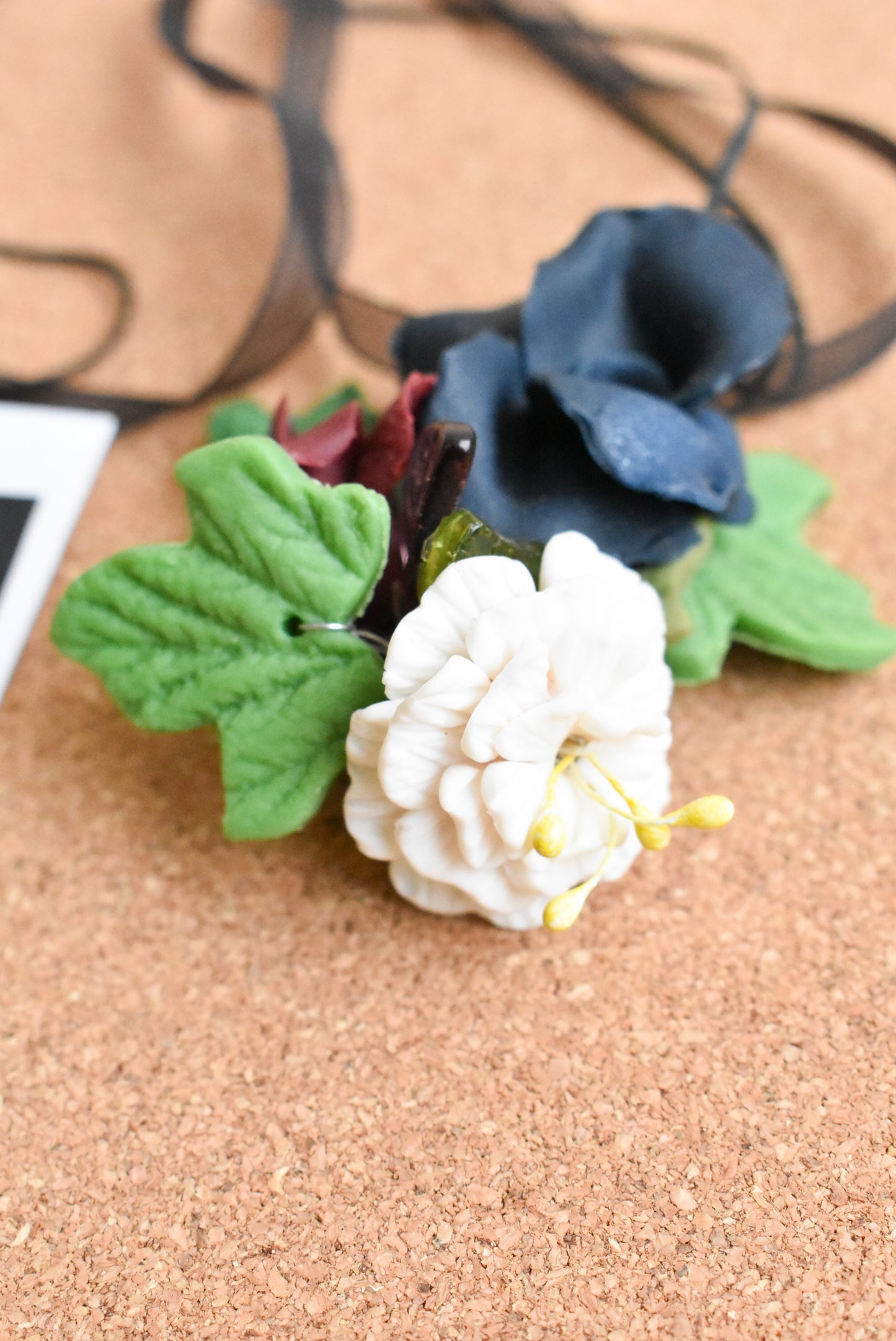 Ceramic flower ribbon necklace with large blue and white flowers