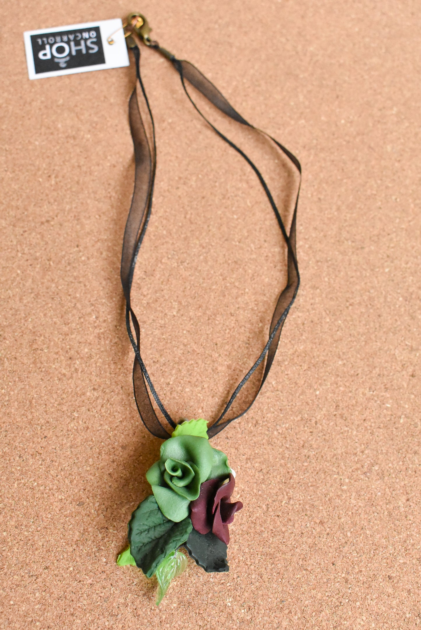 Ceramic flower ribbon necklace with green and purple flowers