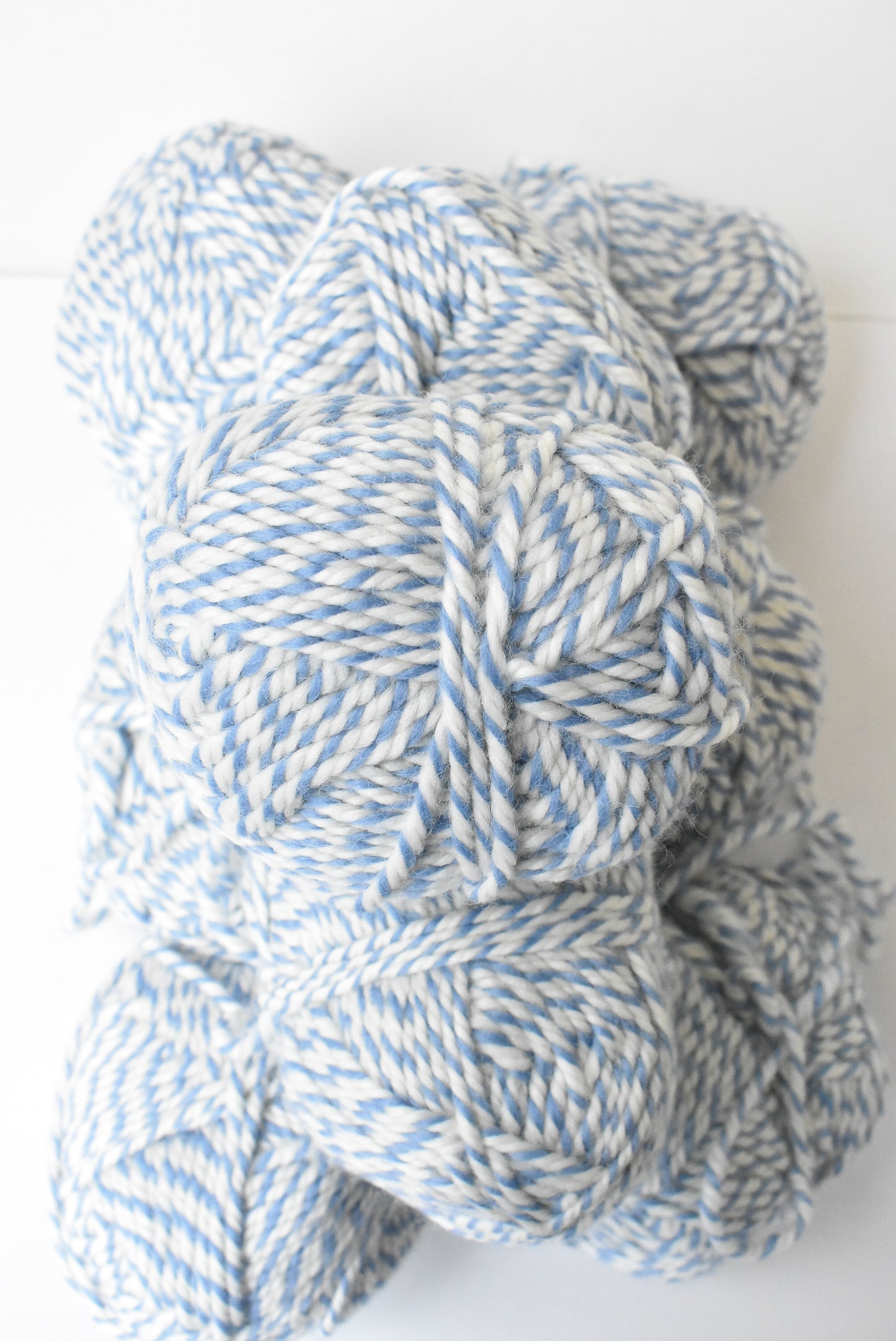9 balls of chunky blue & white wool