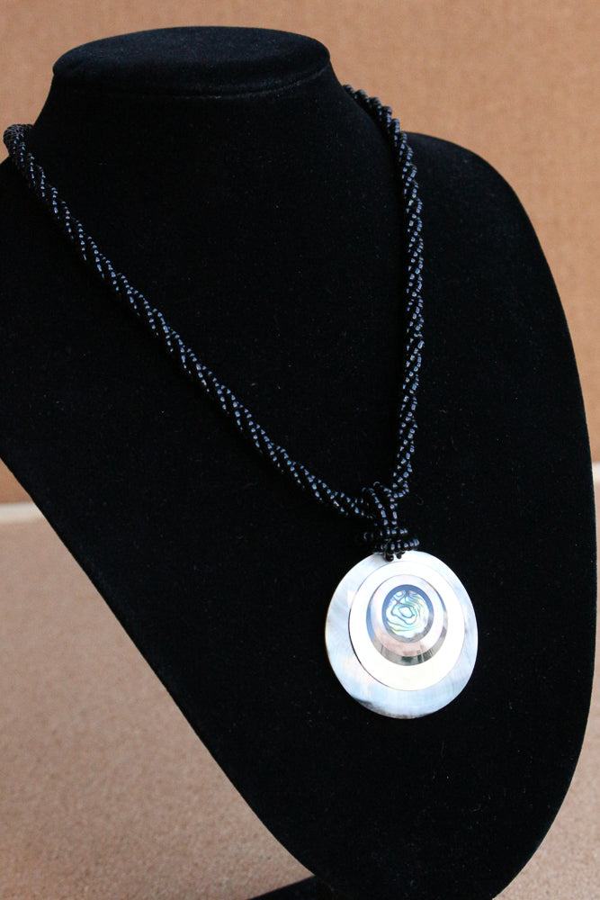 Shell and bead pendant