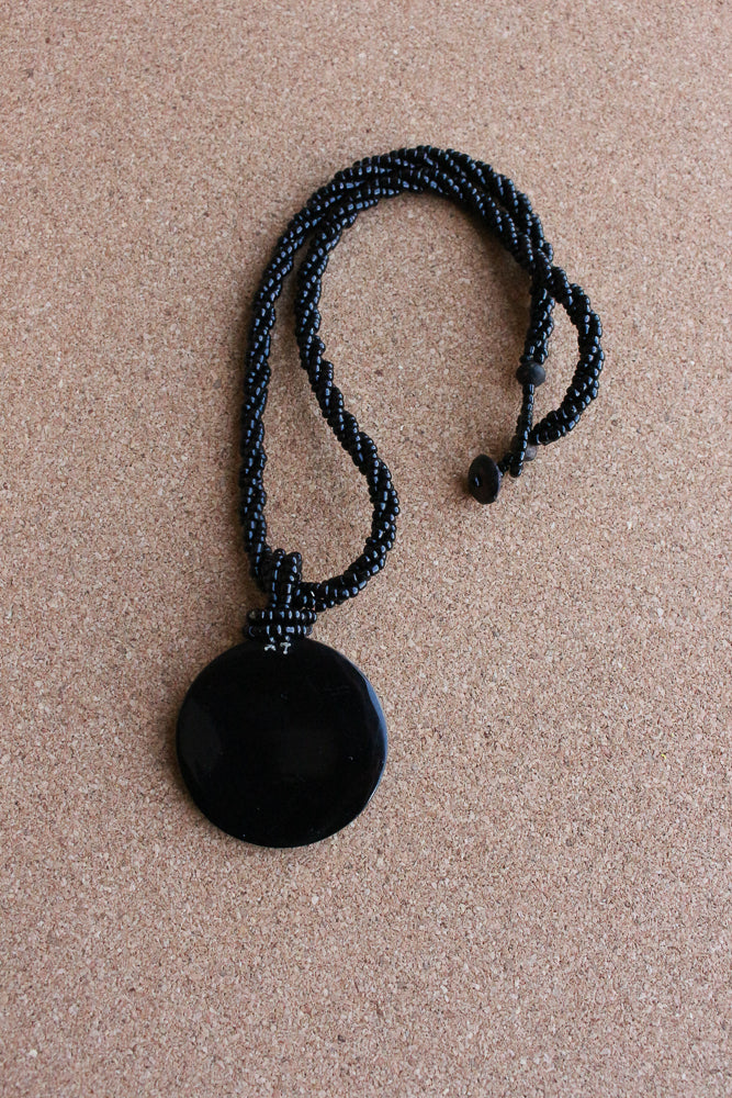 Shell and bead pendant