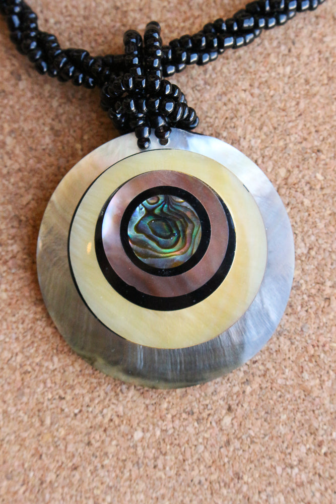 Shell and bead pendant