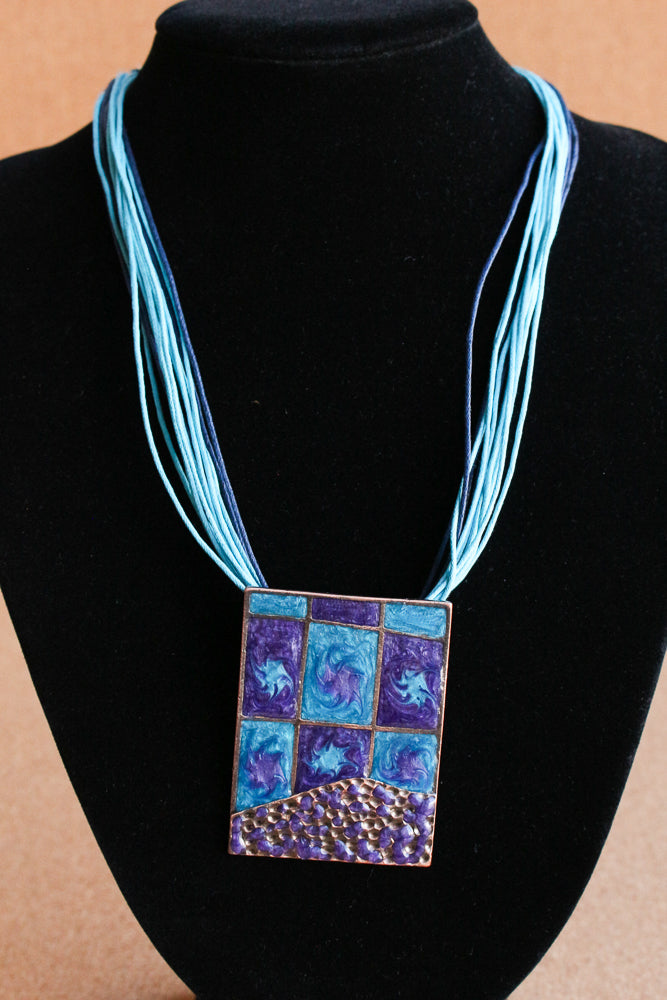 Blue enameled pendant