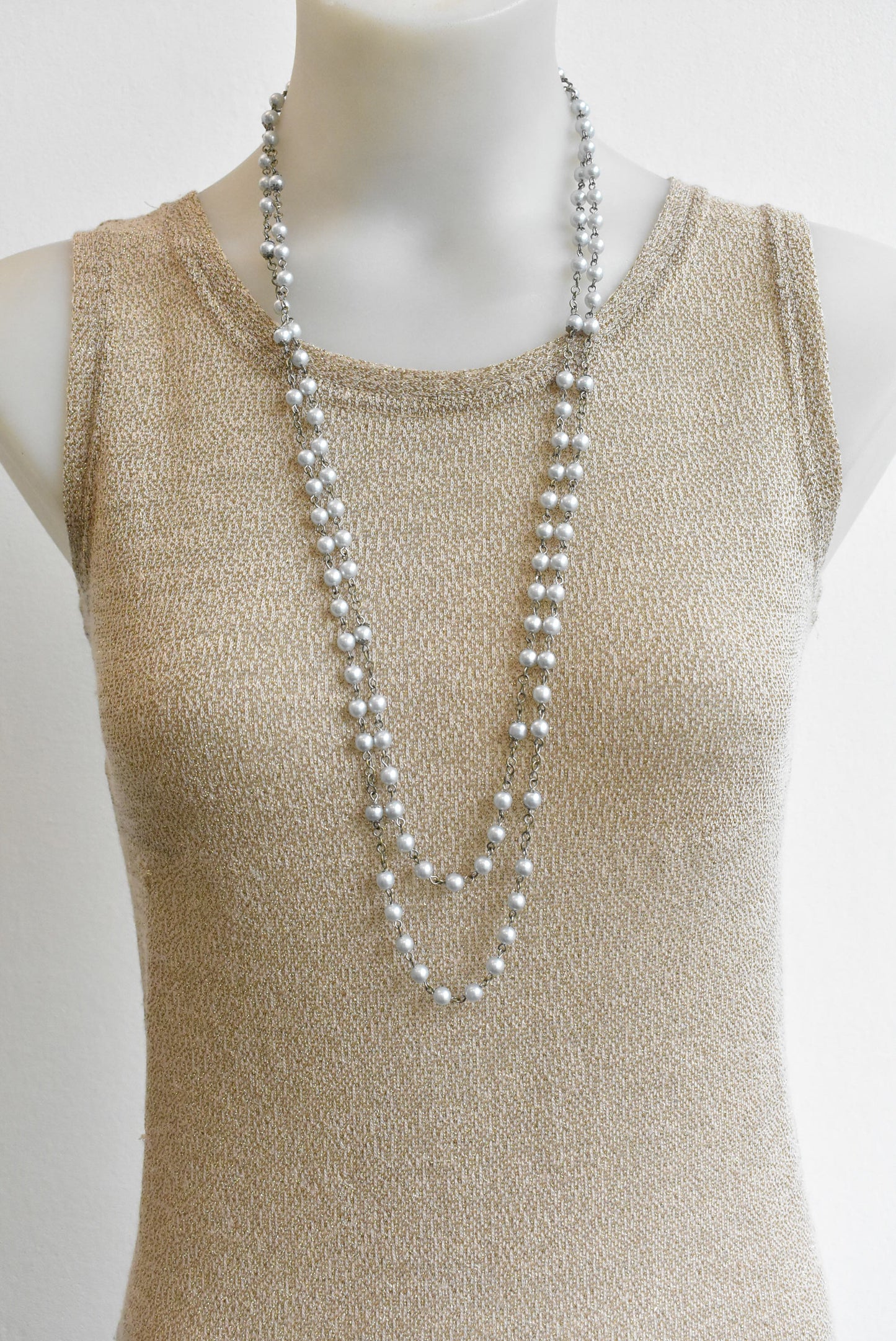 Long pearlescent bead necklace