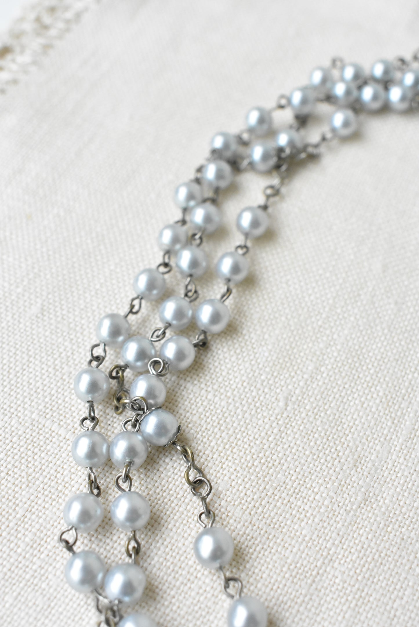 Long pearlescent bead necklace