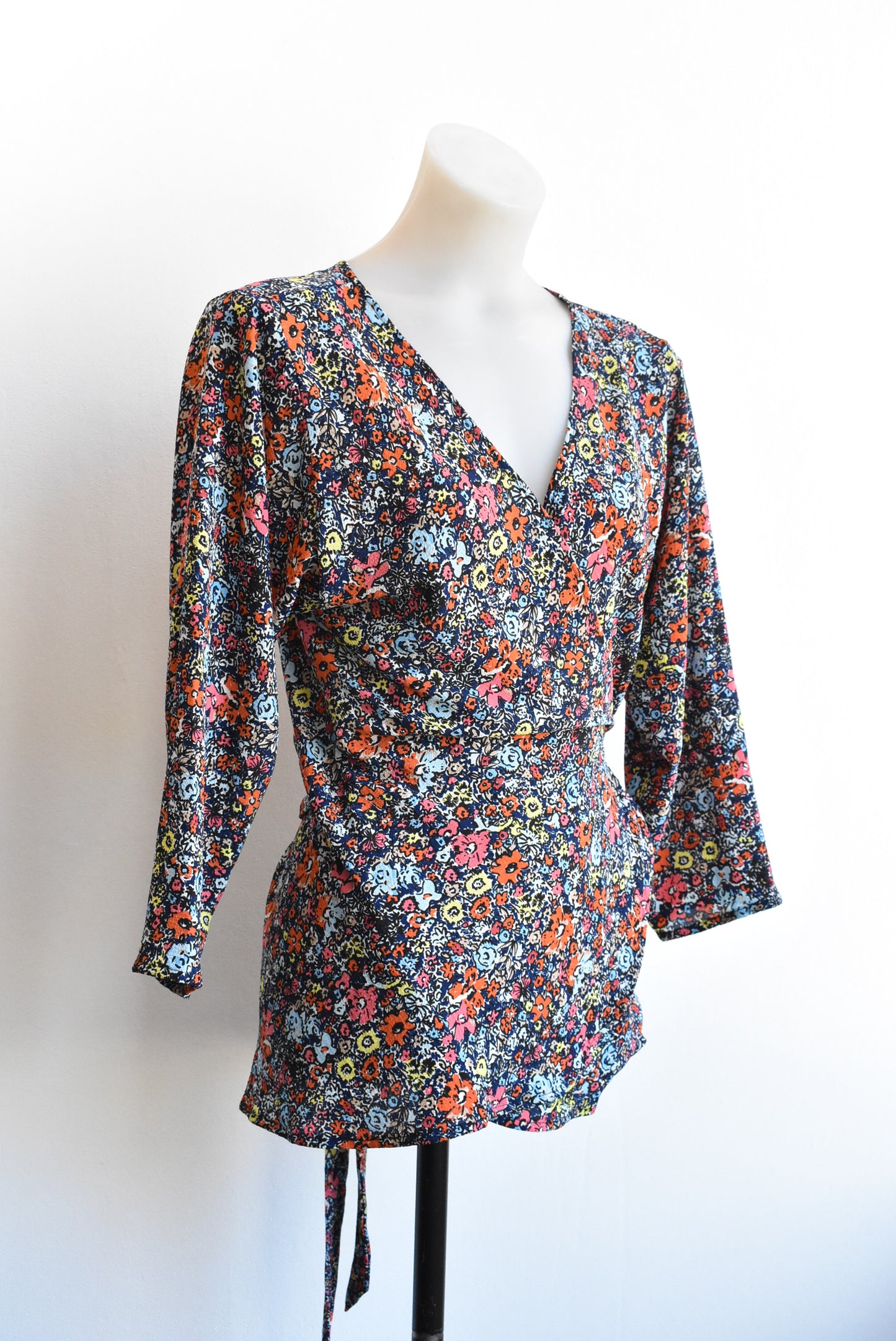 Carly Harris dark blue and orange florals wrap top
