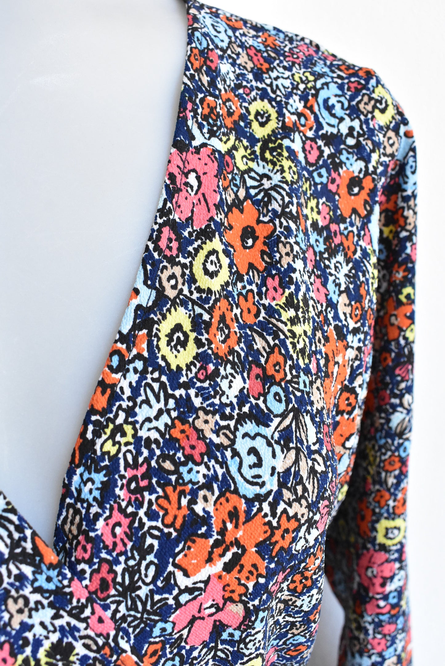 Carly Harris dark blue and orange florals wrap top