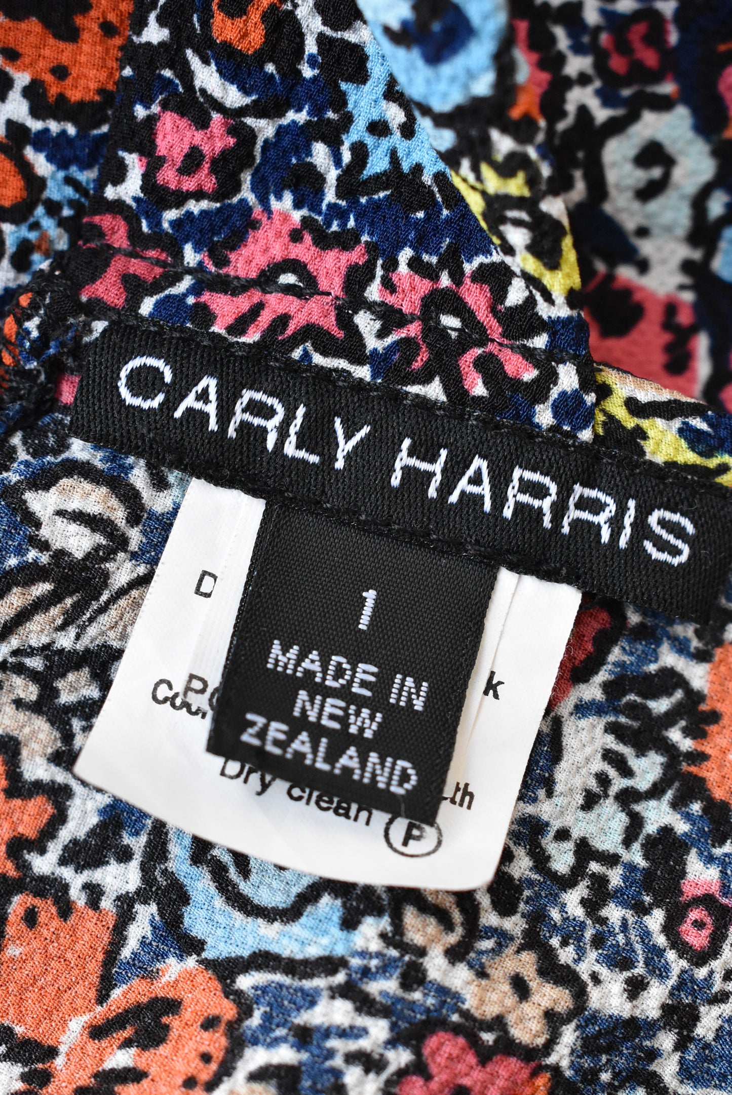 Carly Harris dark blue and orange florals wrap top