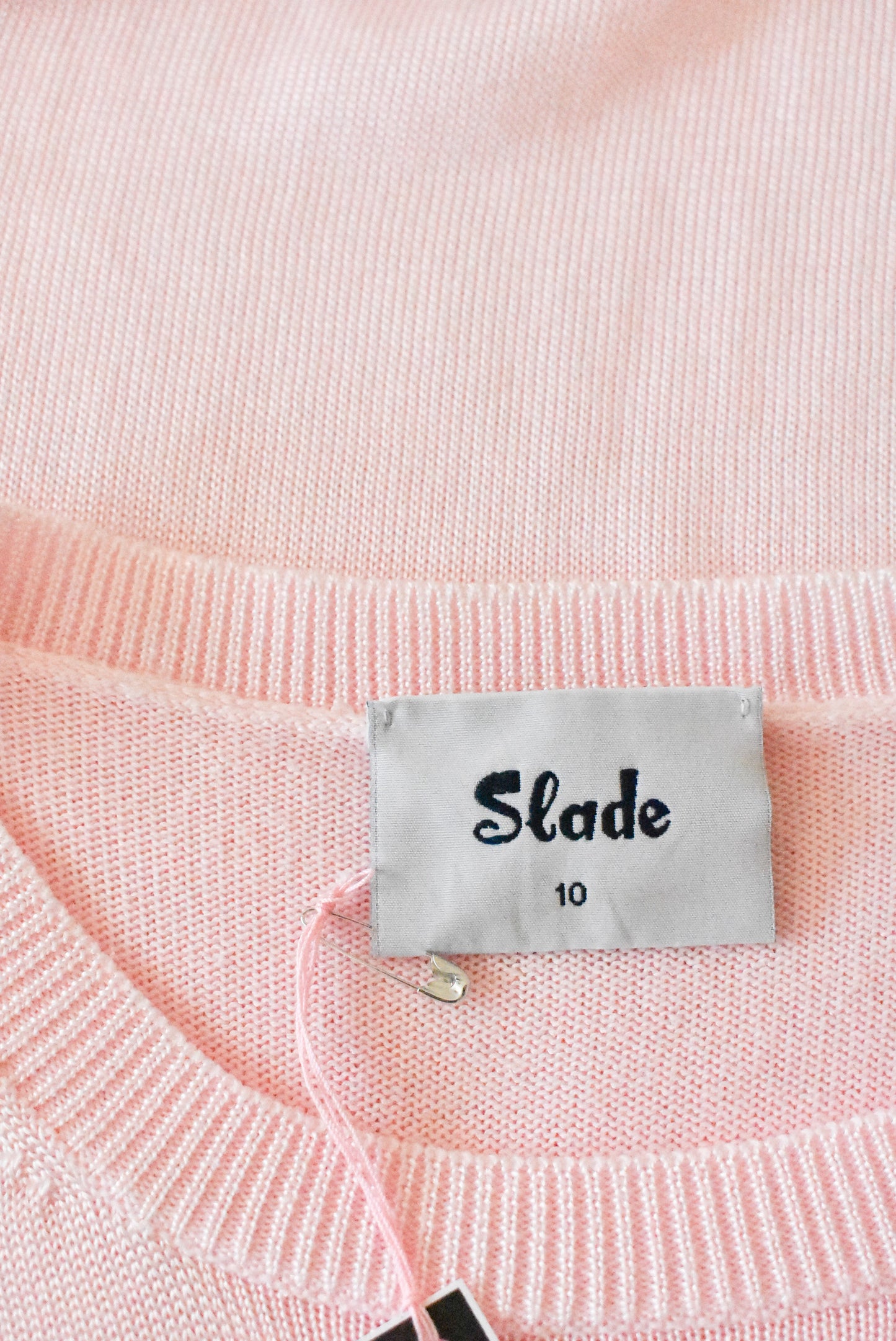 Slade retro-style baby pink knit, size 10