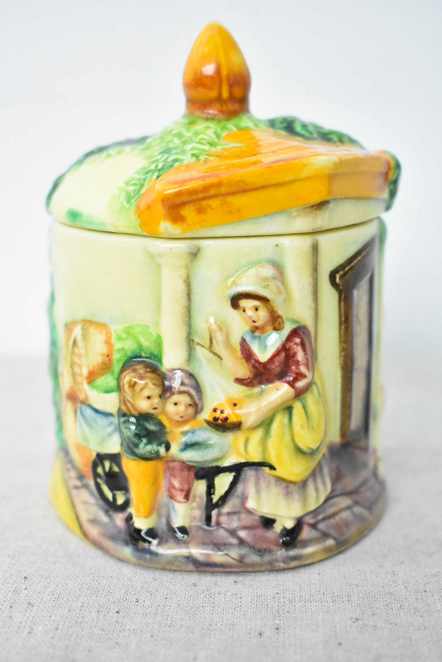 Vintage jam pot depicting English countryside