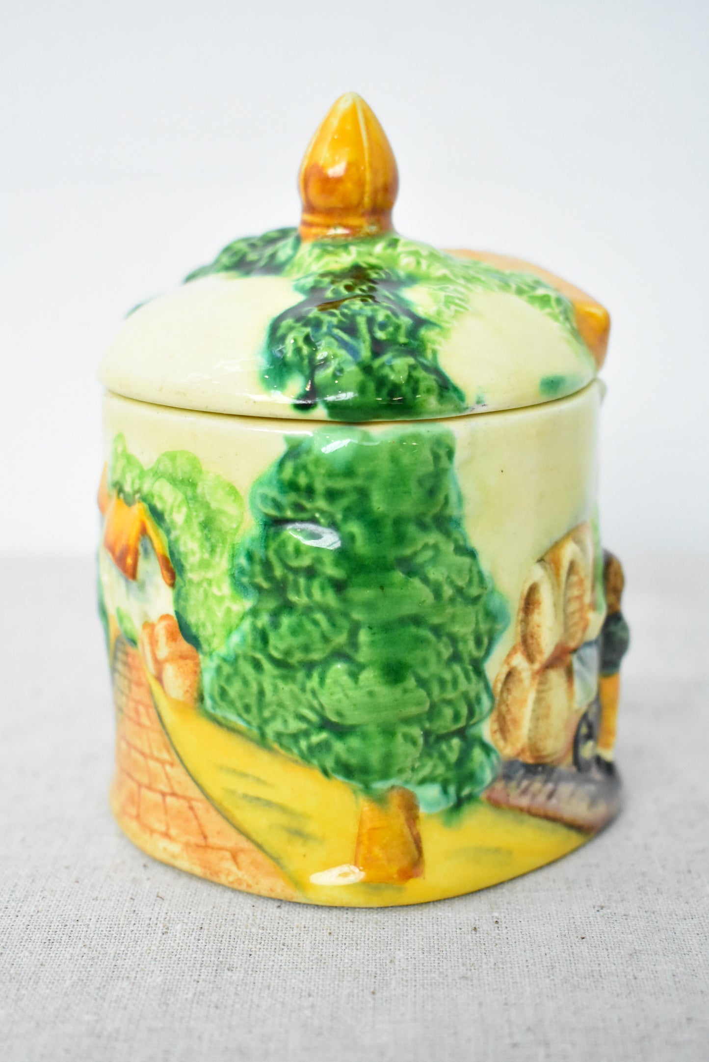 Vintage jam pot depicting English countryside