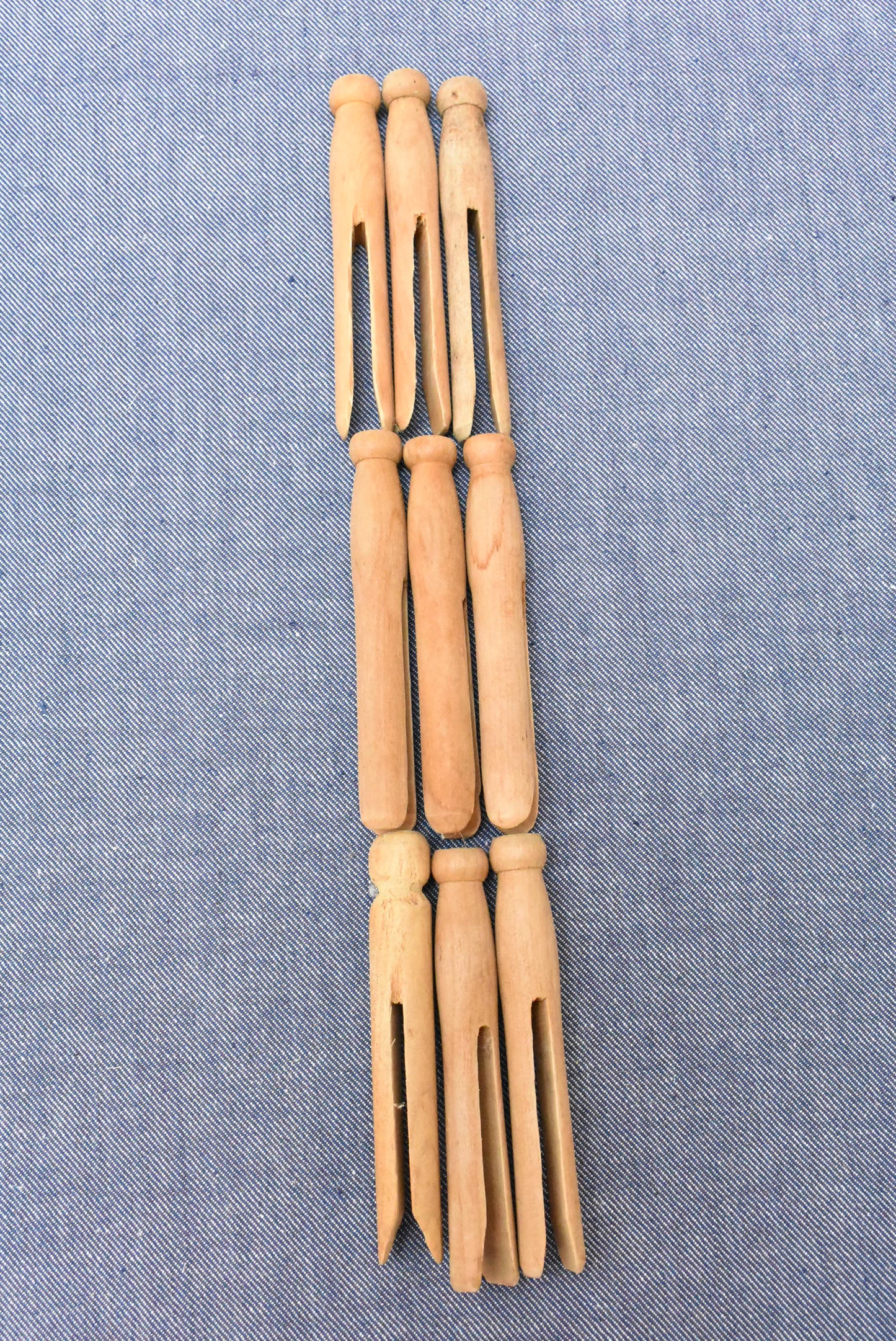 9 wooden clothes pegs