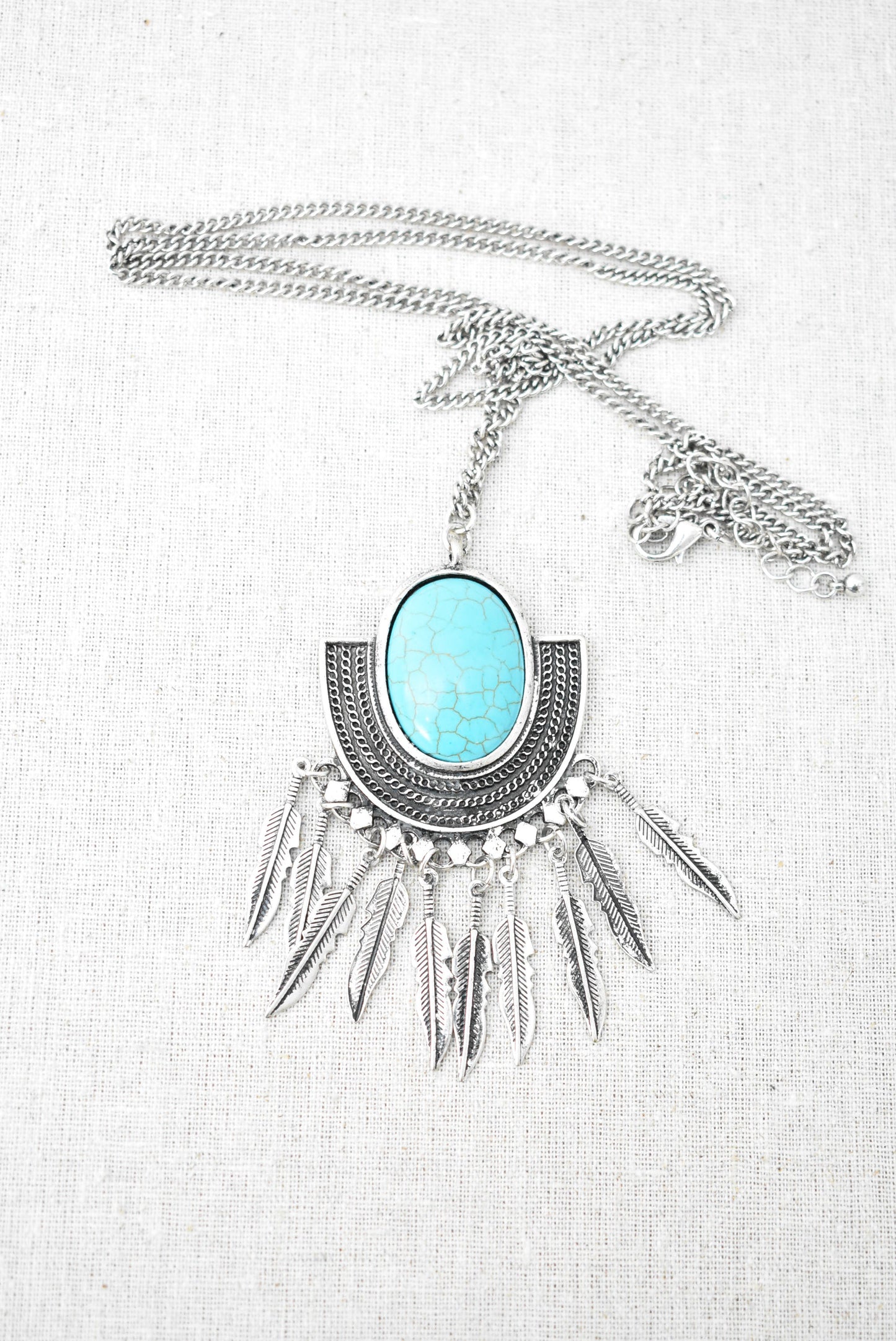 'Turquoise' and feathers statement pendant