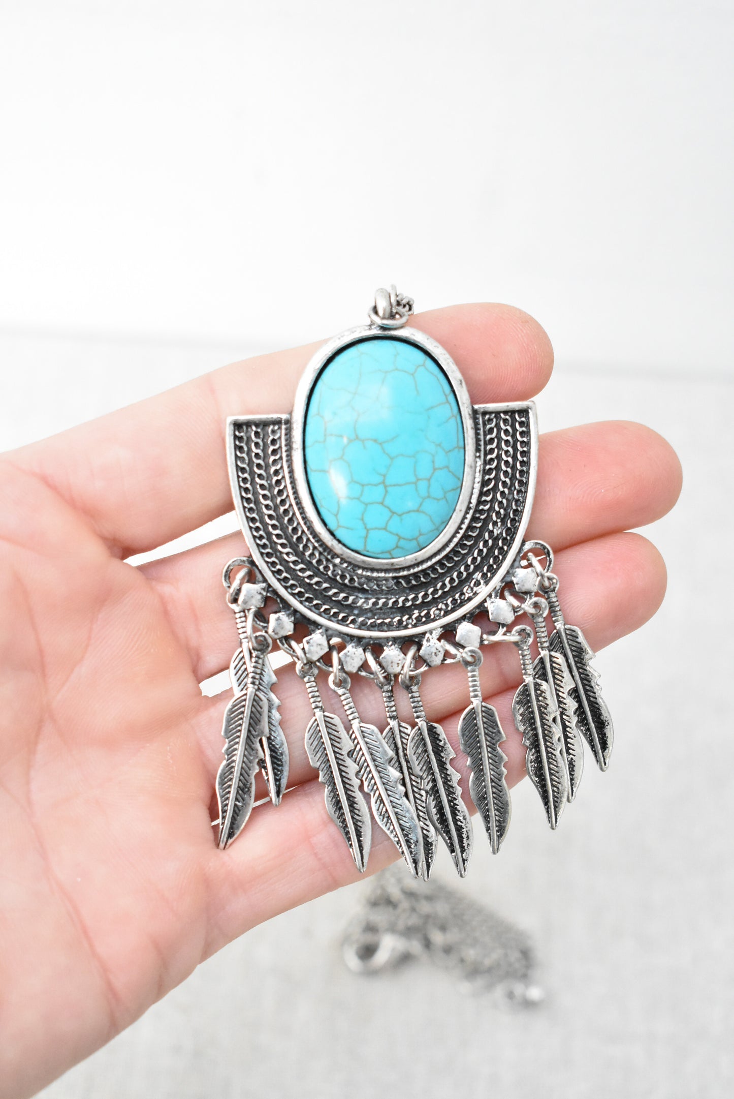 'Turquoise' and feathers statement pendant