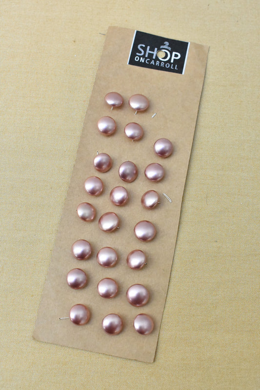 Vintage pink plastic buttons