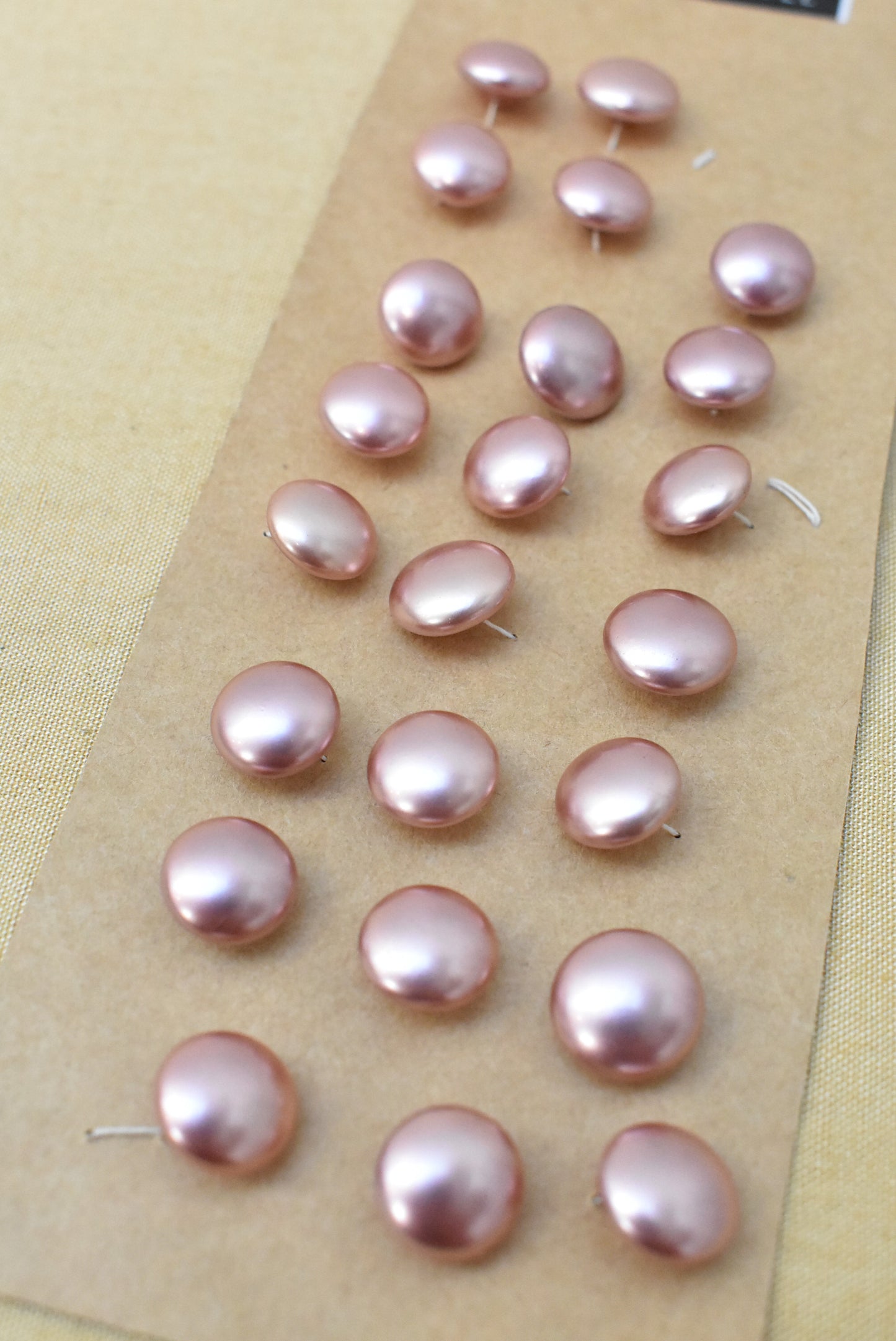 Vintage pink plastic buttons