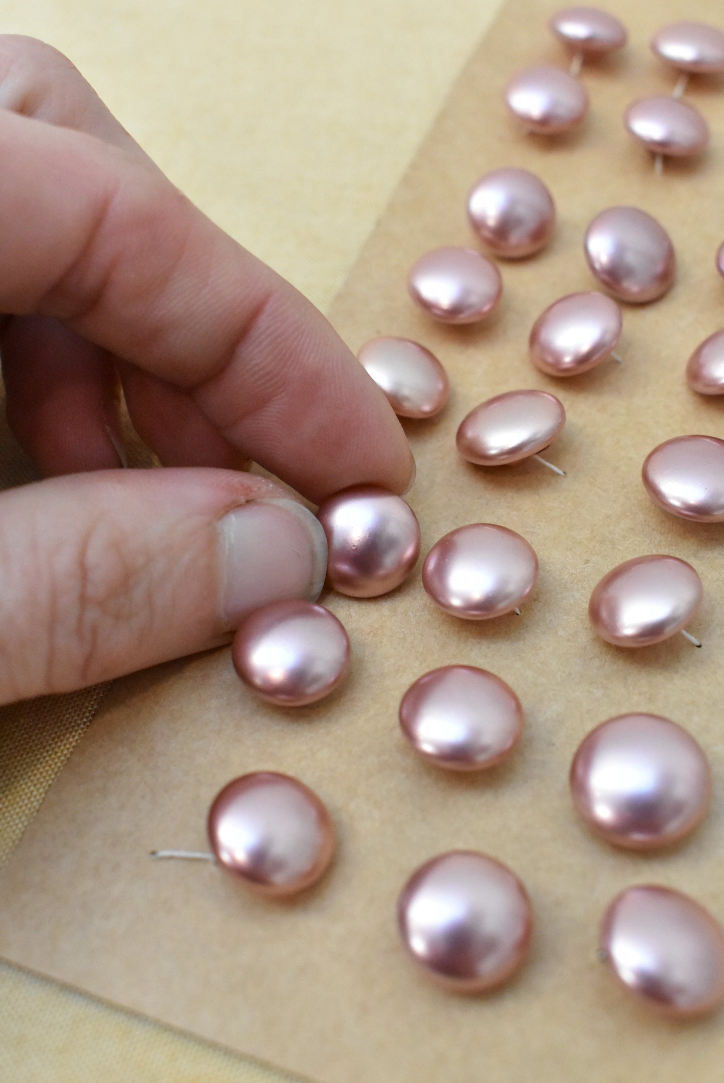 Vintage pink plastic buttons