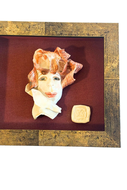 Funky framed clay portrait