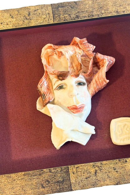 Funky framed clay portrait