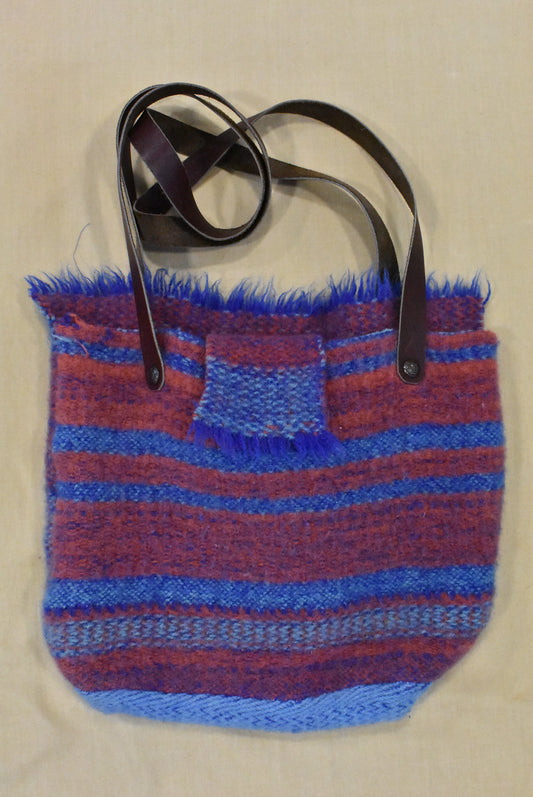 Woven wool bag with leather straps