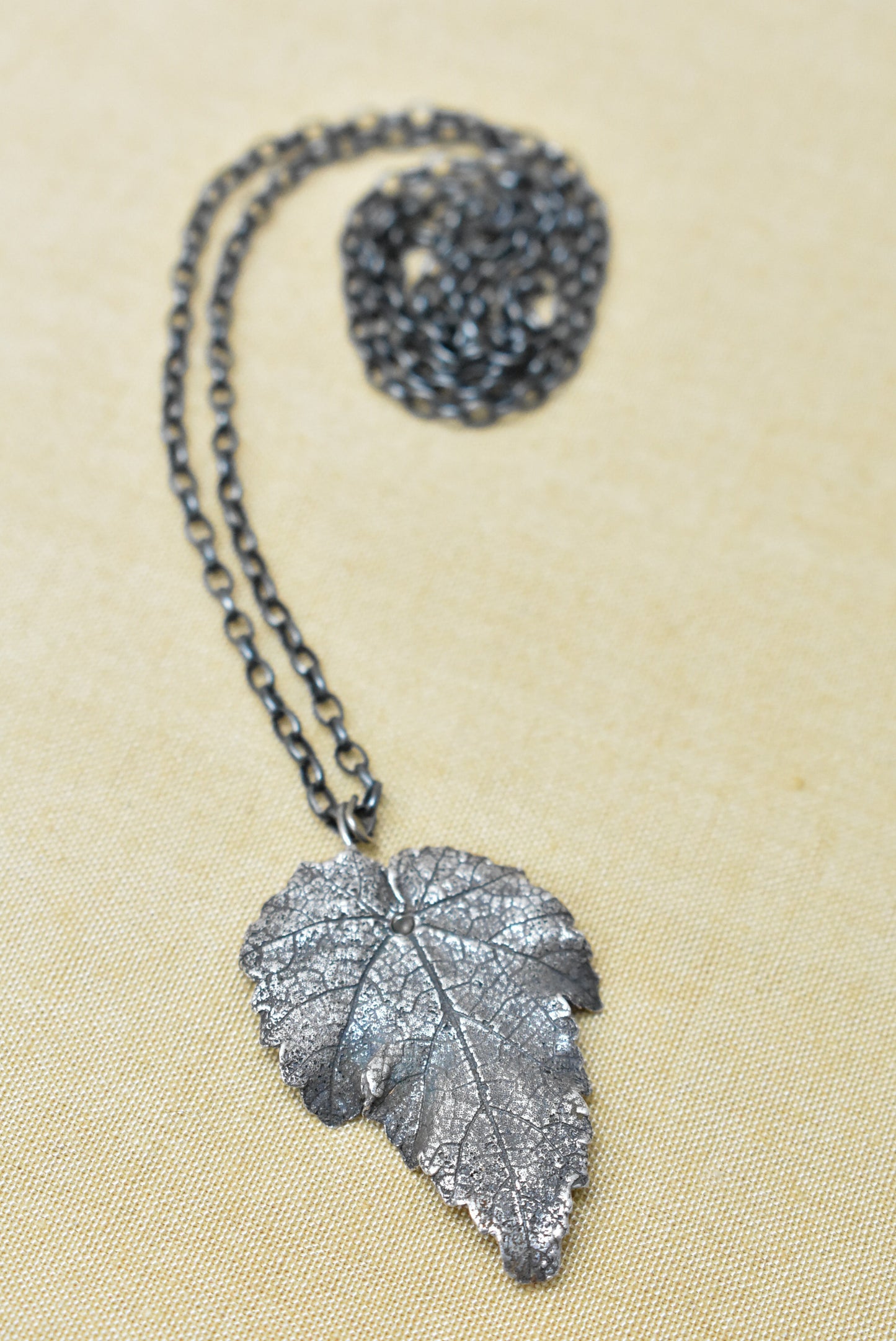 Silver embossed leaf pendant necklace
