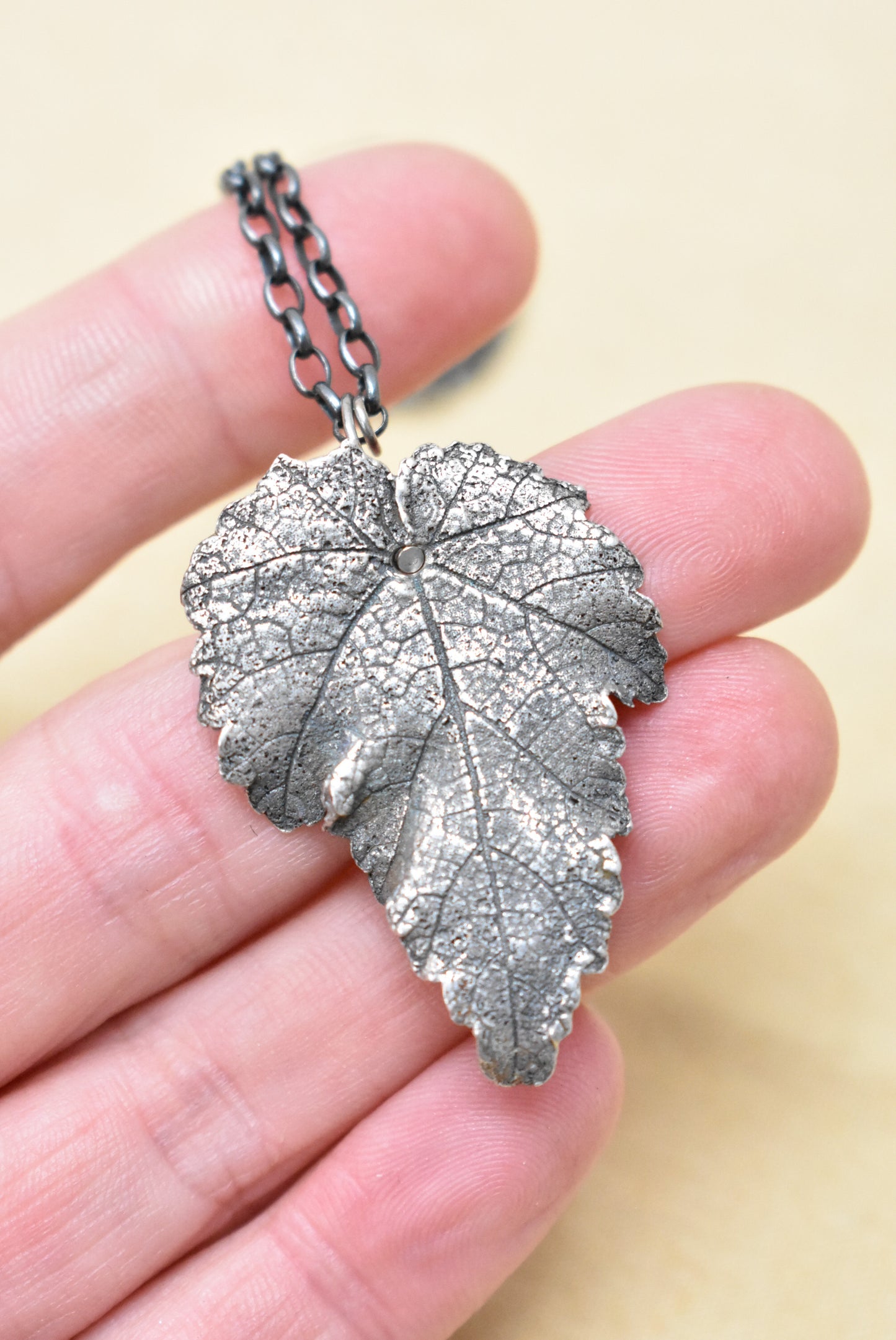 Silver embossed leaf pendant necklace