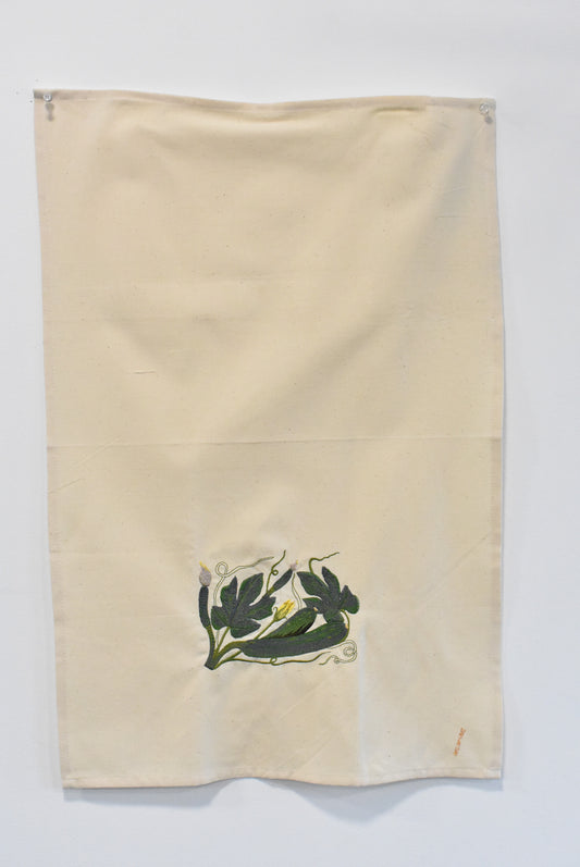 Cotton tea towel with machine embroidery feature