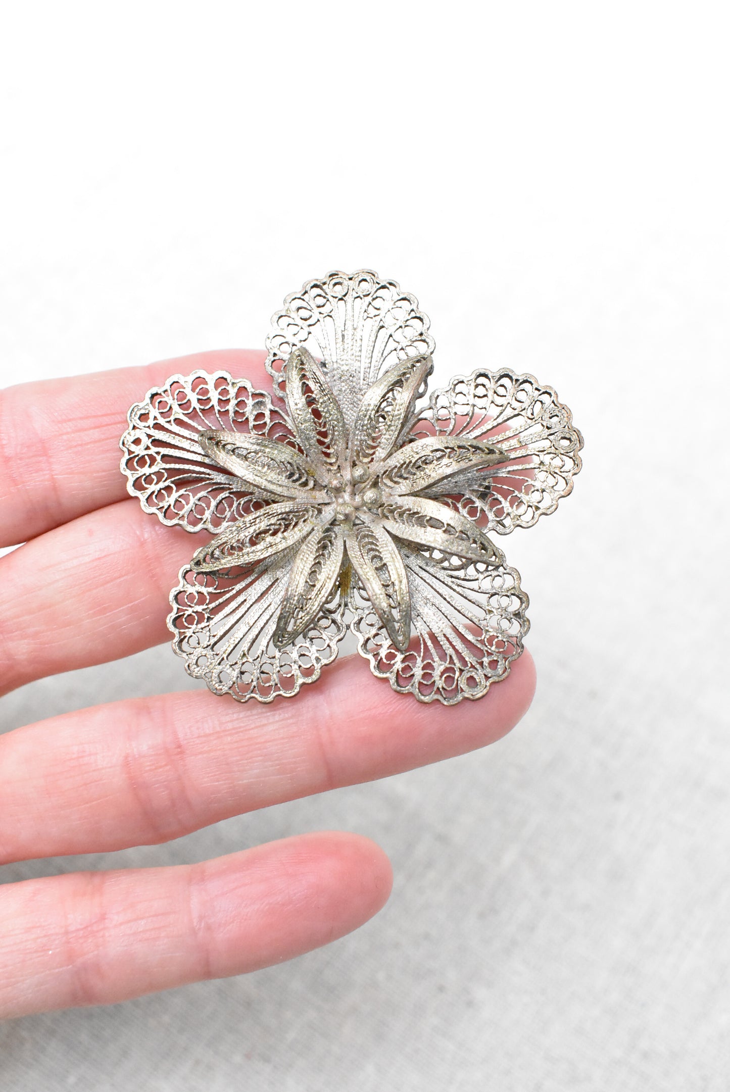 Vintage silver filigree flower brooch