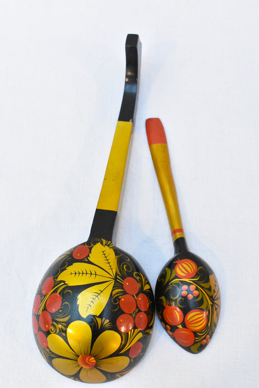 Mismatched pair of Russian hand-painted lacquered spoons