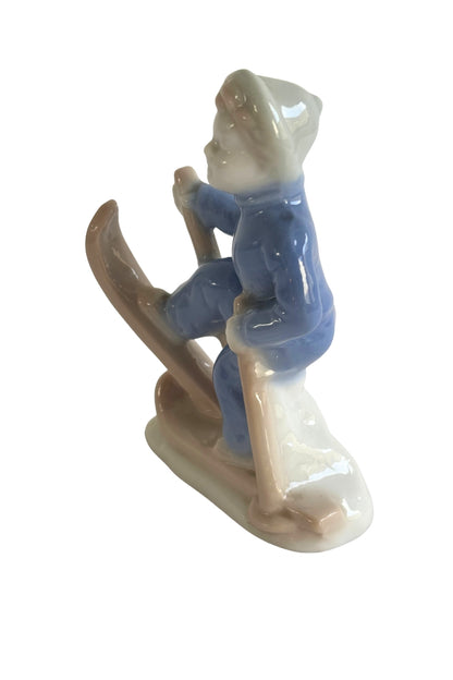Vintage skier boy figurine