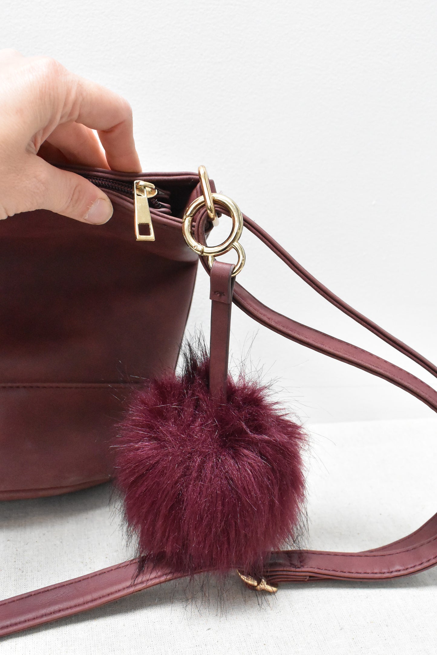 Burgundy bag with fuzzy tassle key ring (New)