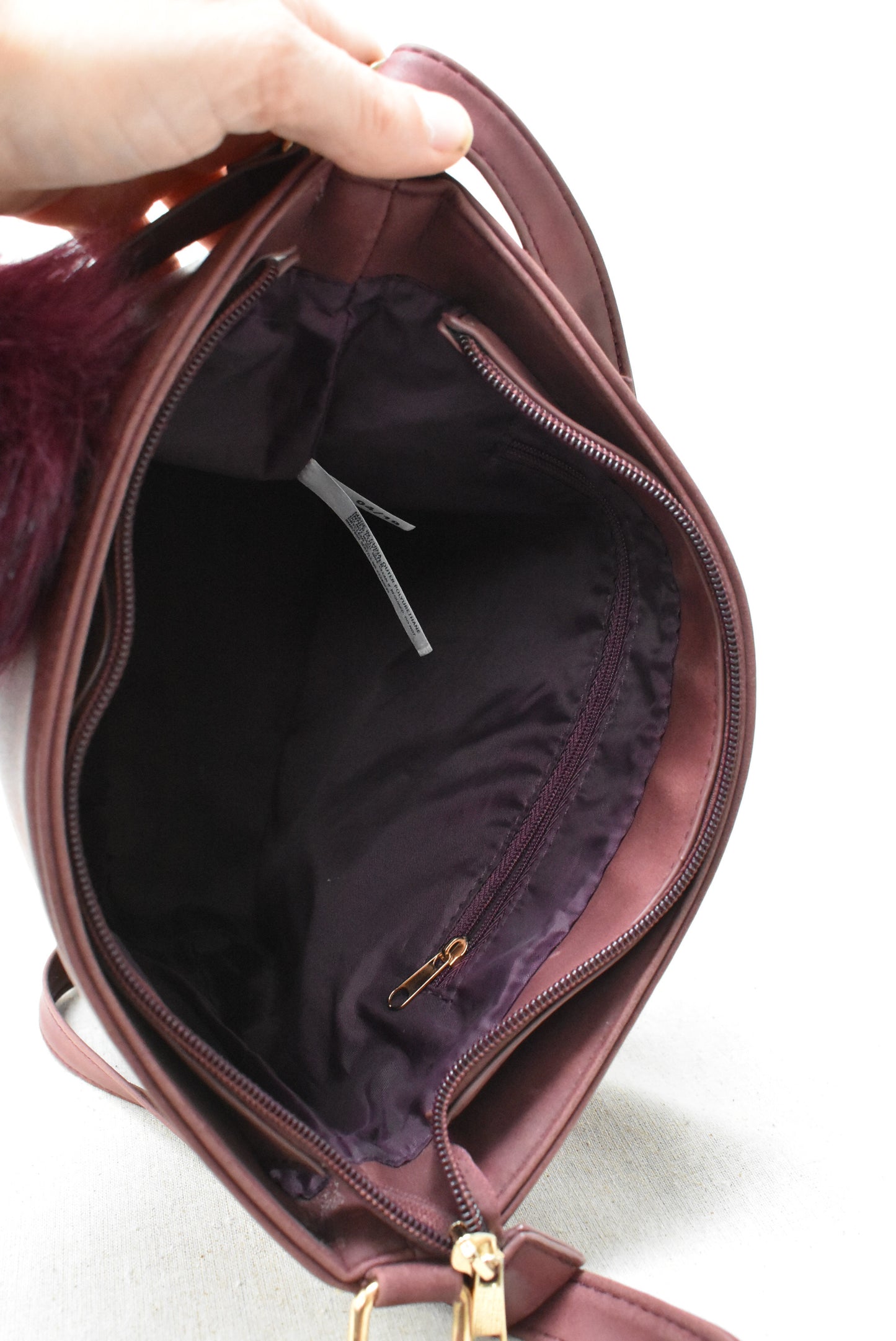 Burgundy bag with fuzzy tassle key ring (New)