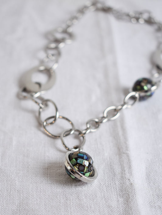 Funky silver coloured paua globe necklace