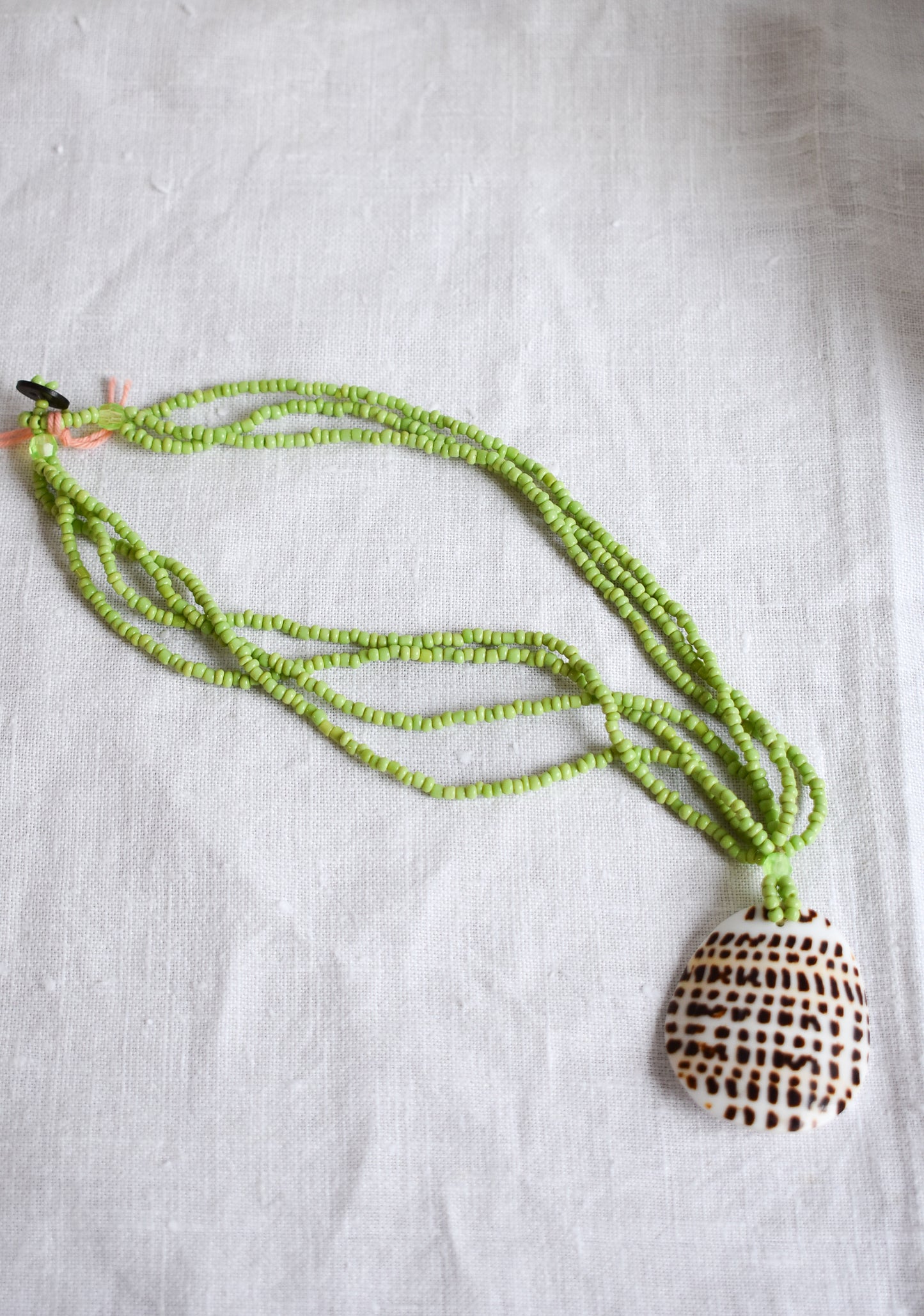 Gorgeous green beaded spotted shell necklace