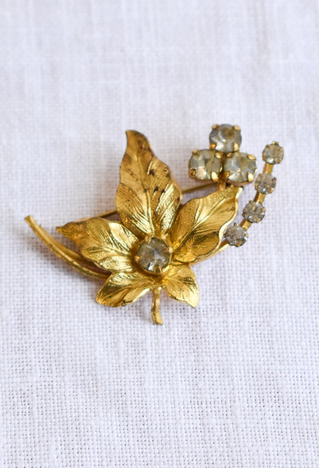 Maple leaf gold coloured broach