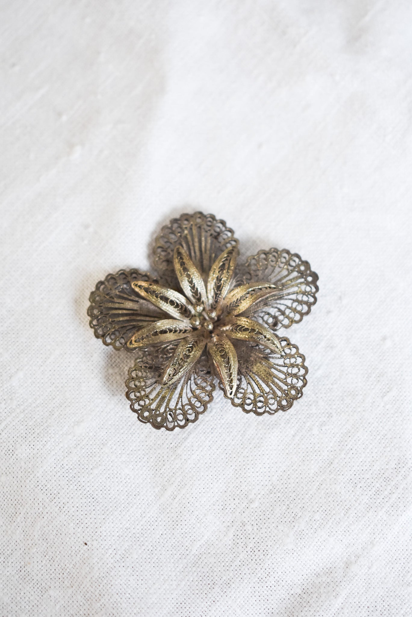 Vintage silver filigree flower brooch