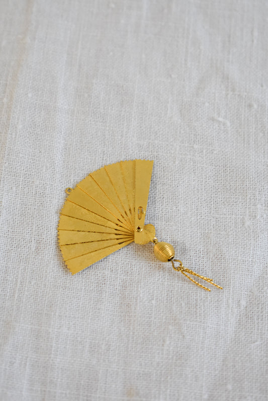 Delicate golden fan pendant